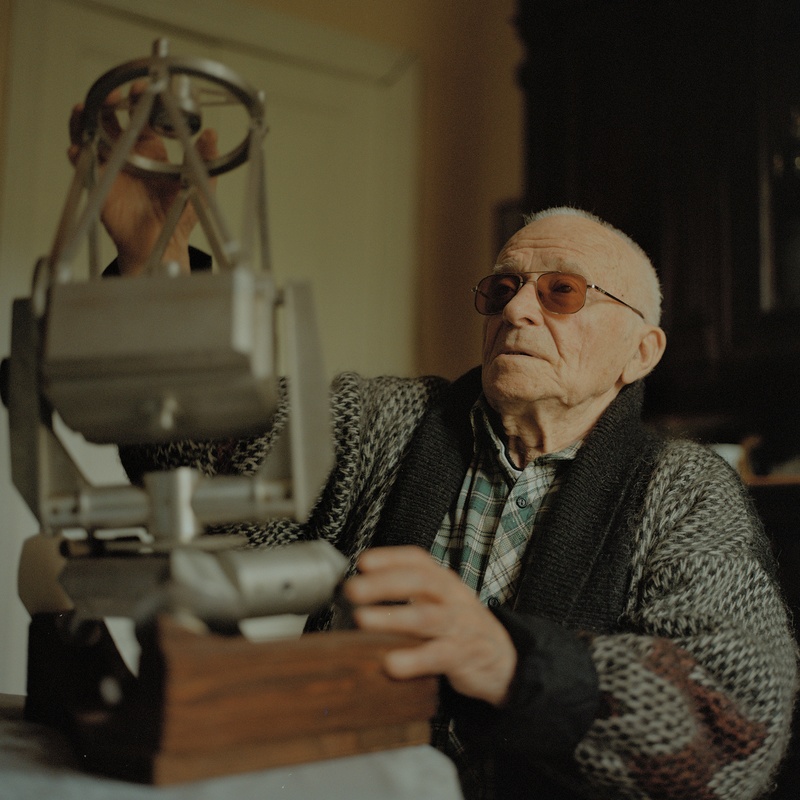 Yuriy Streletskiy, ex-lead design engineer of the observatory. At the time of the photograph, he is ninety-three years old. Having lost his sight, he can recognize any of his many model telescopes by touch and describe the principles of their operation.