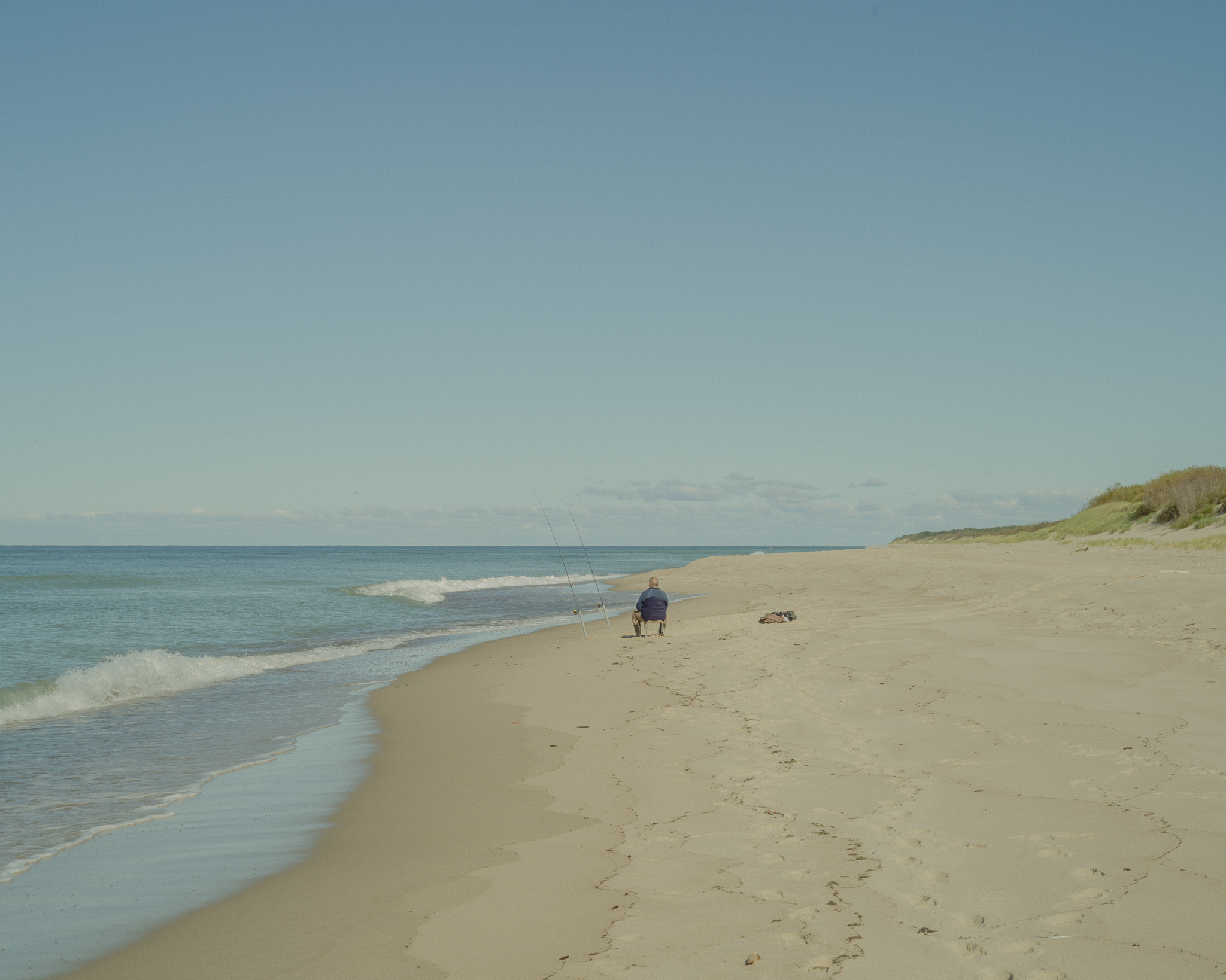 A fisherman on the shore. The coast of the Baltic Sea here hides the world’s largest deposits of amber. The waves constantly wash small pieces onto the beach, and after a storm one can collect kilograms of the valuable resin.